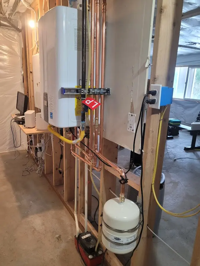 Licensed plumber repairing a kitchen sink in Liberty