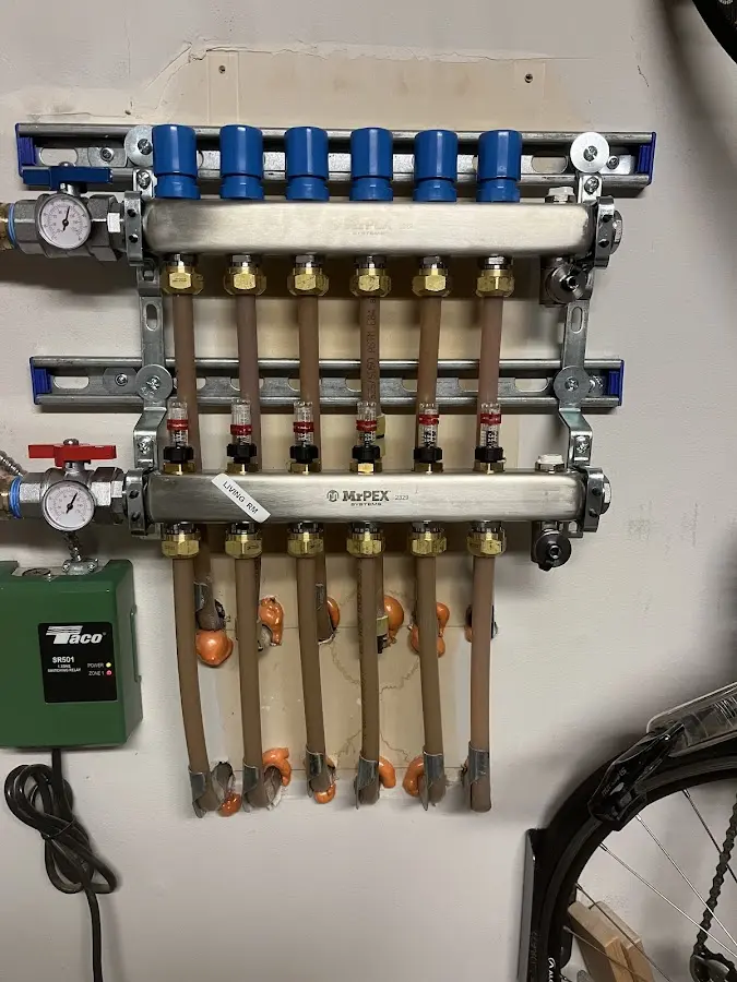 Plumber performing Water Heater Repair at a residential property in Liberty